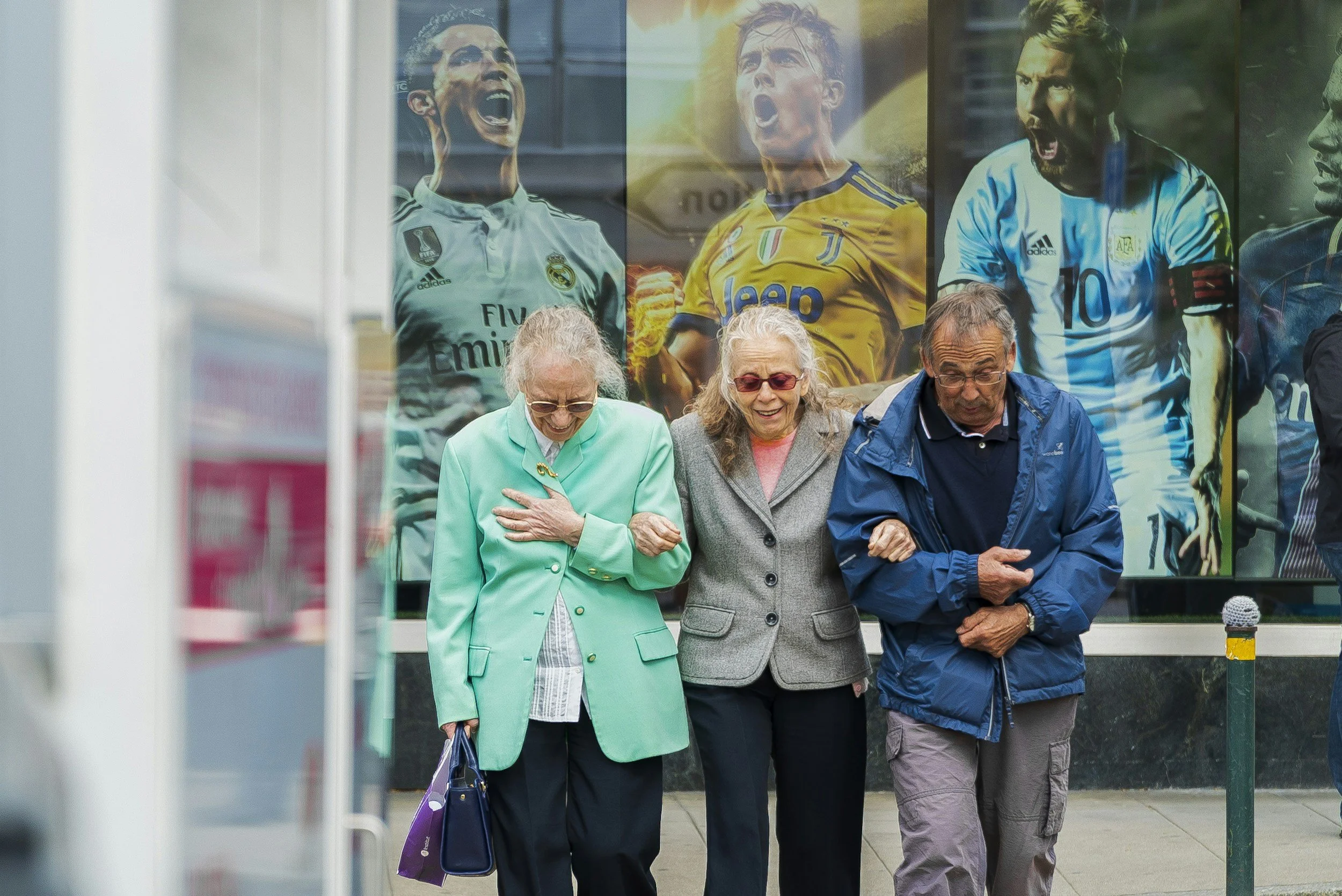 Trio of healthy older friends walking together
