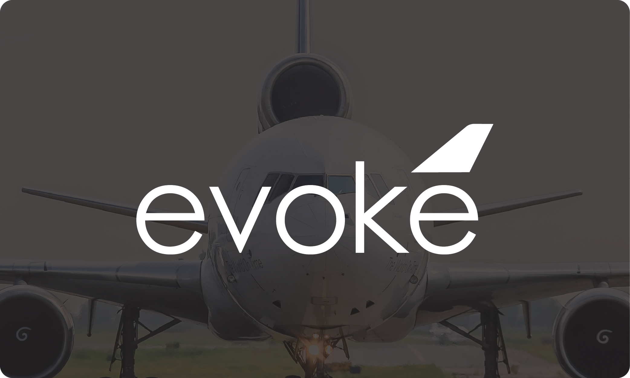 Front view of a commercial airplane. Overlaid text says 'Evoke' in logo form.