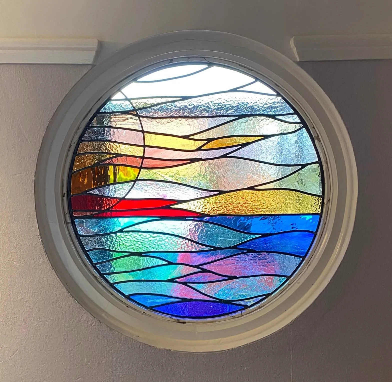 Colourful abstract stained glass window designed and fitted with over 35 years of craftsmanship and expertise.