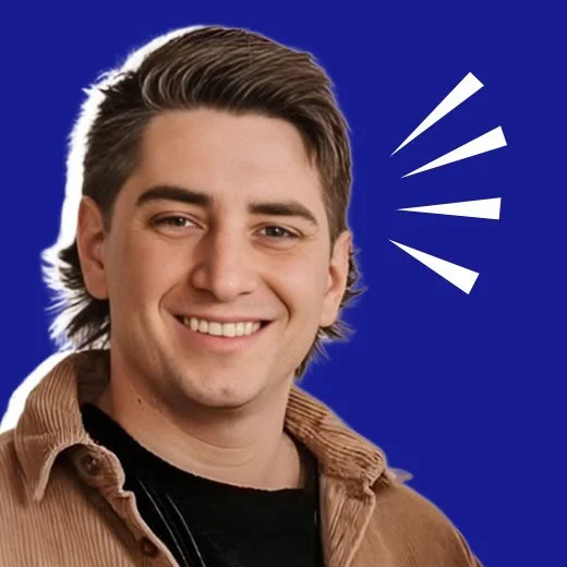 Young man smiling with stylized lines indicating surprise or excitement against a blue background.