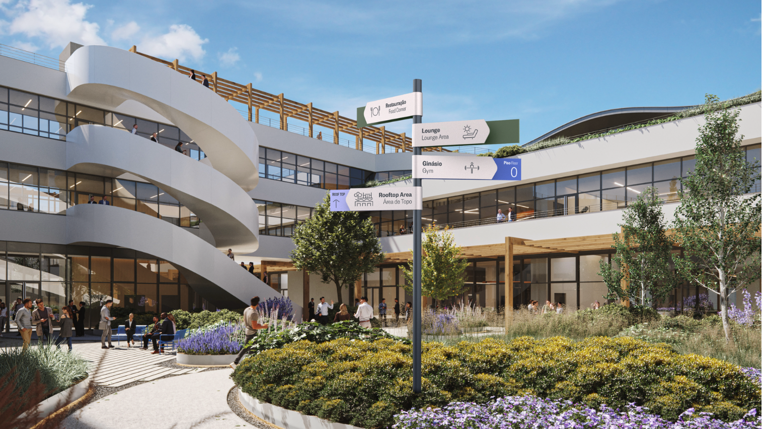 Modern multi-story building with glass windows and outdoor walkways, greenery, and a landscaped courtyard with people walking, sitting, and socializing.