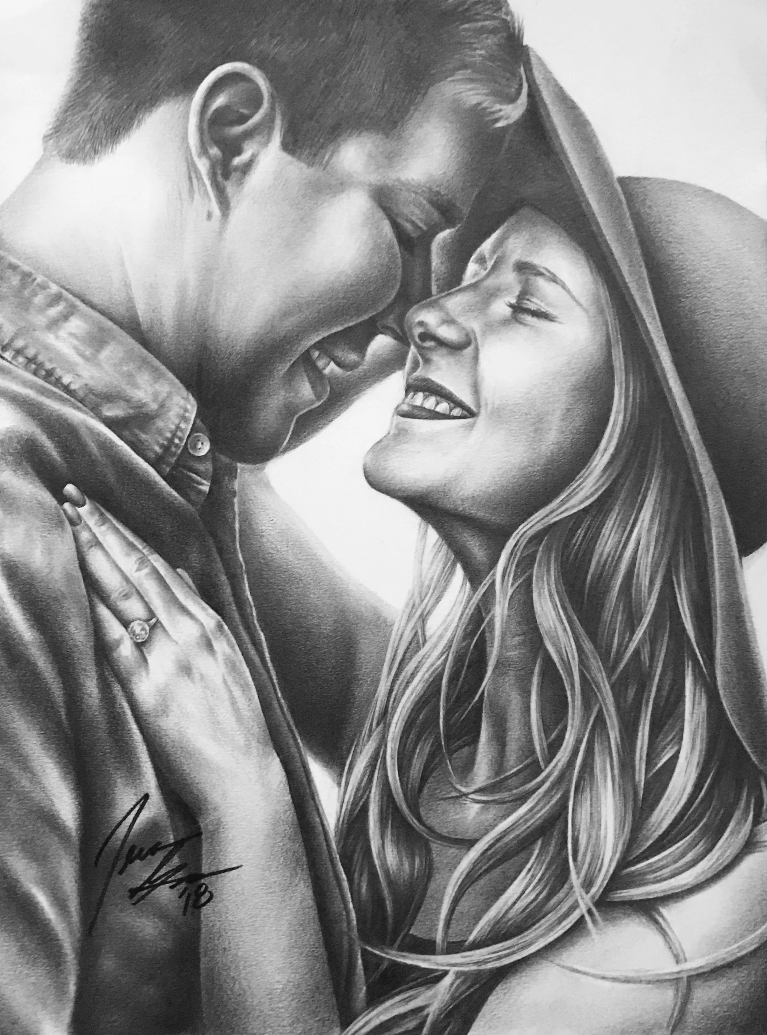 A black and white portrait of a man and woman in a close embrace, smiling with their eyes closed. The woman has long, wavy hair, and the man is leaning his forehead against her. There is a signature and date in the lower left corner.
