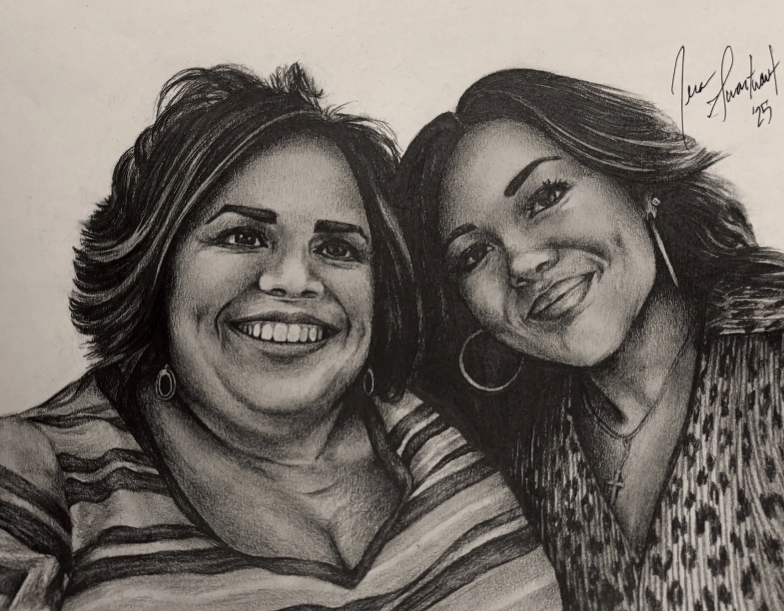 Black and white portrait of two smiling women with wavy hair, wearing hoop earrings, and striped clothing.