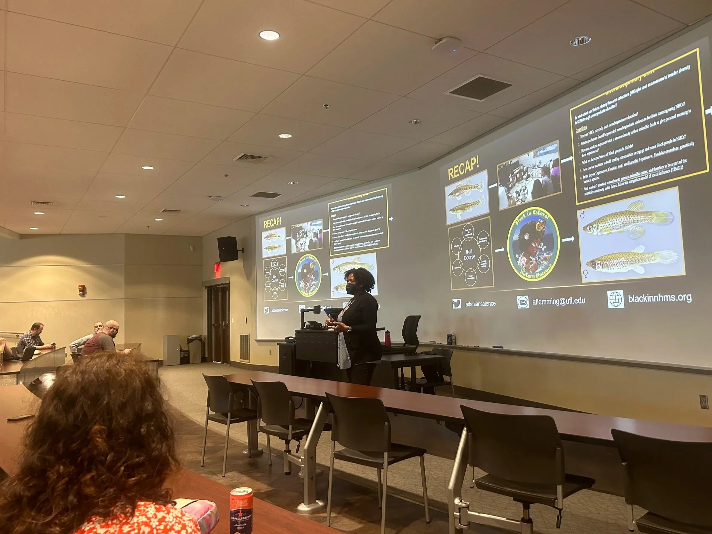 Dr. Adania Flemming giving a guest seminar at the University of Alabama, with a summary slide illustrating the interdisciplinary connections across her research, education, community engagement, and leadership.