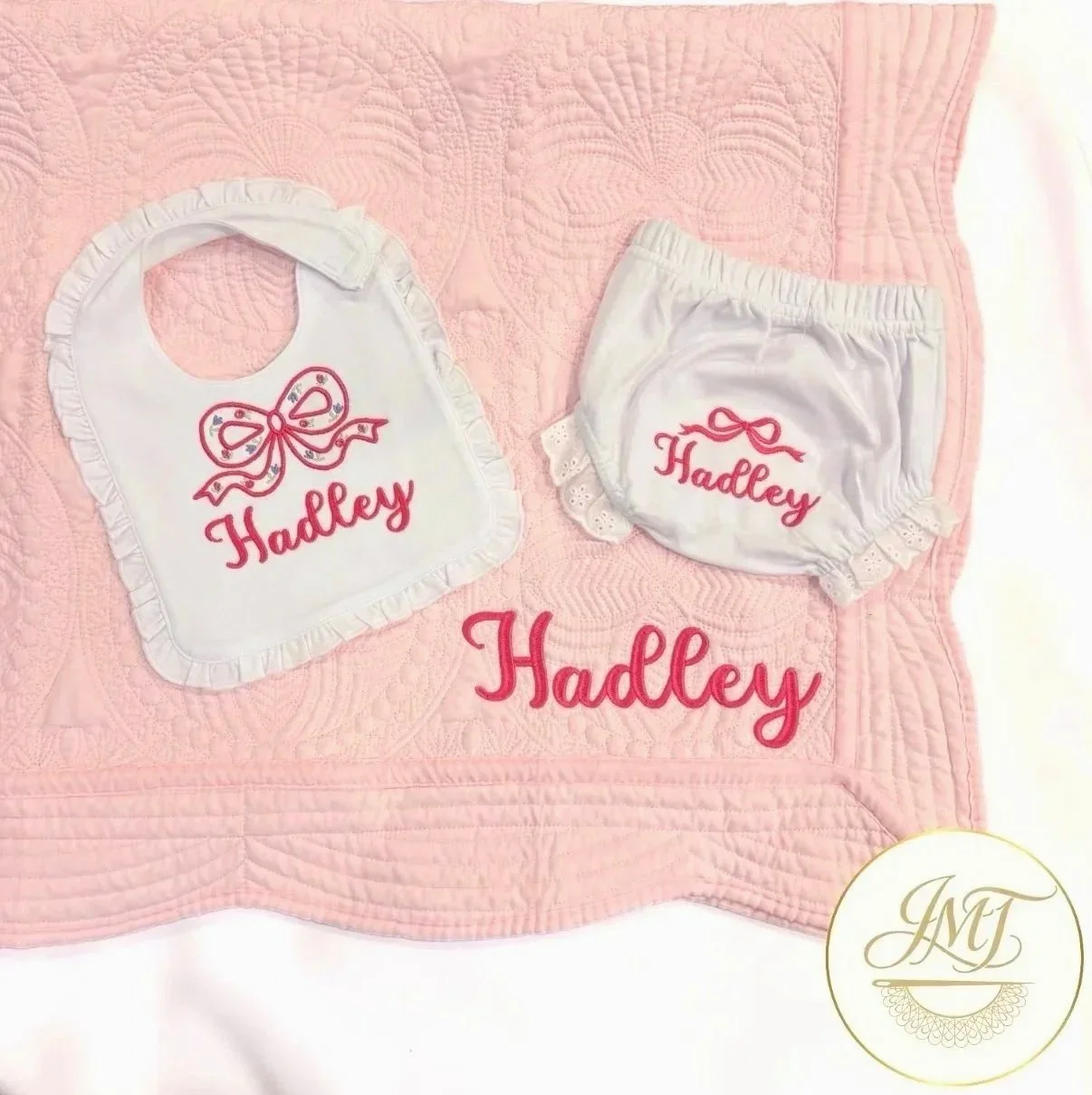 Scalloped boutique bib, baby bloomers, and pink heirloom quilt for baby Hadley.