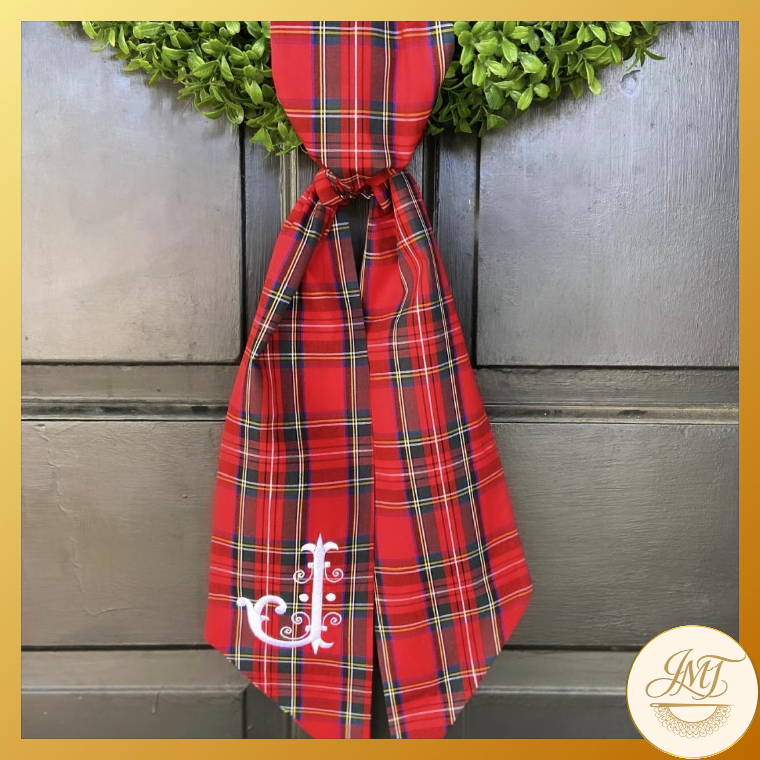 Standard Initial on a red plaid sash.