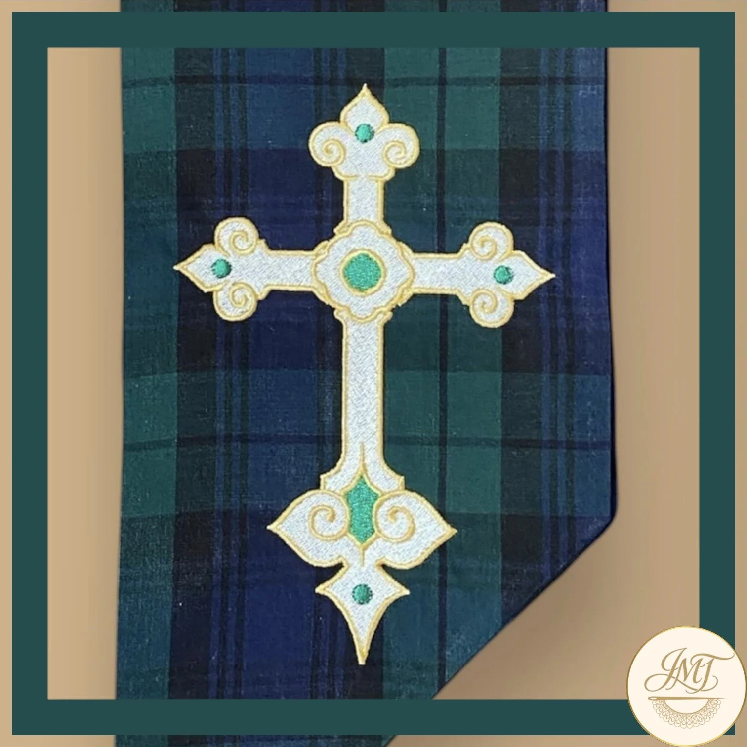Cross design on a green plaid sash.