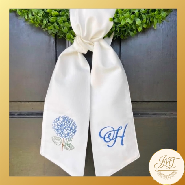 Hydrangea design and a Standard Initial on a white sash. 