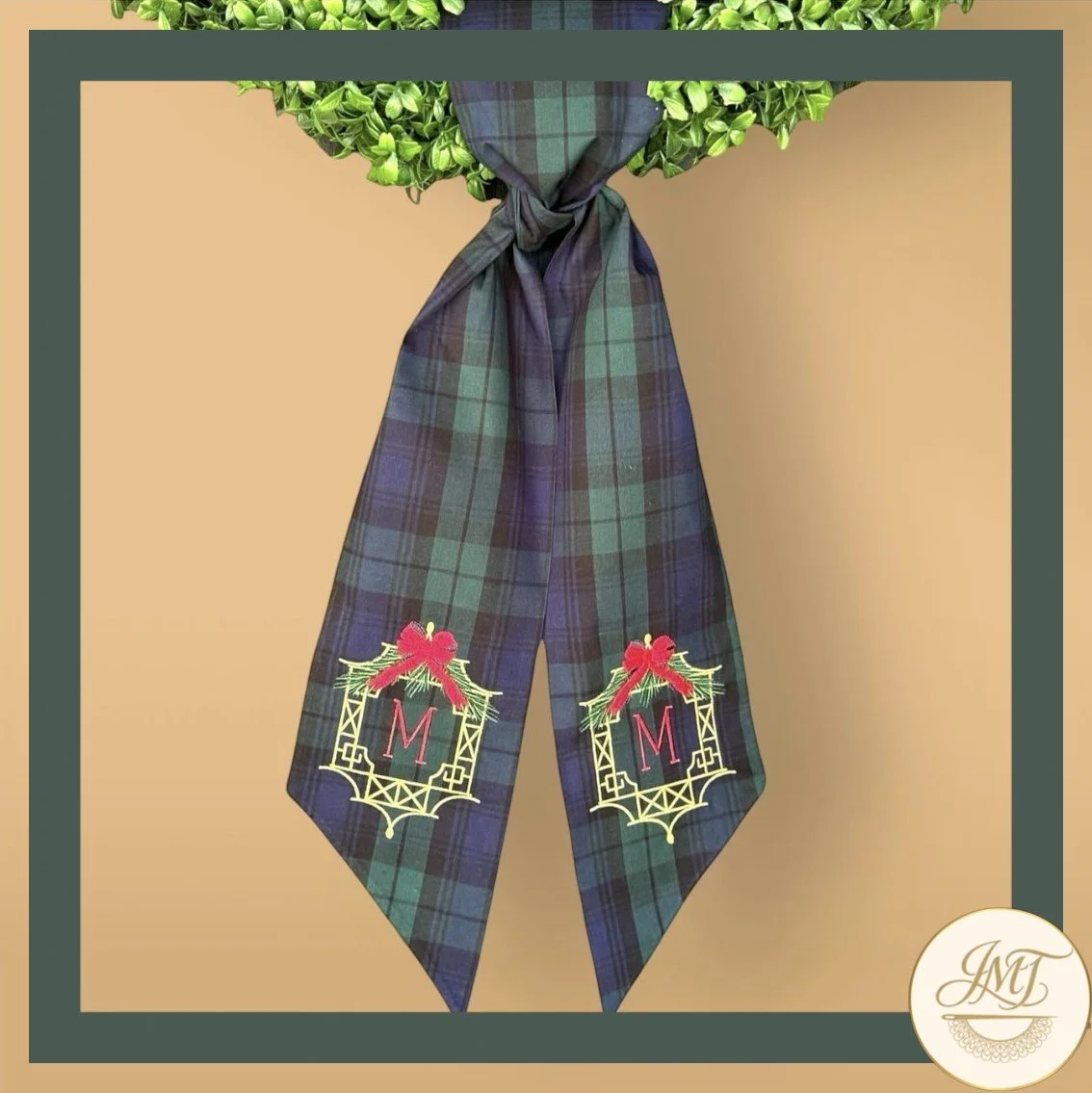 Chinoiserie Premium Initials on a green plaid sash.