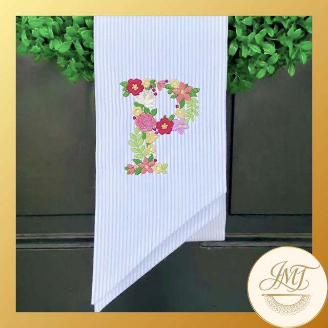 Floral Premium Initial on a blue seersucker sash.