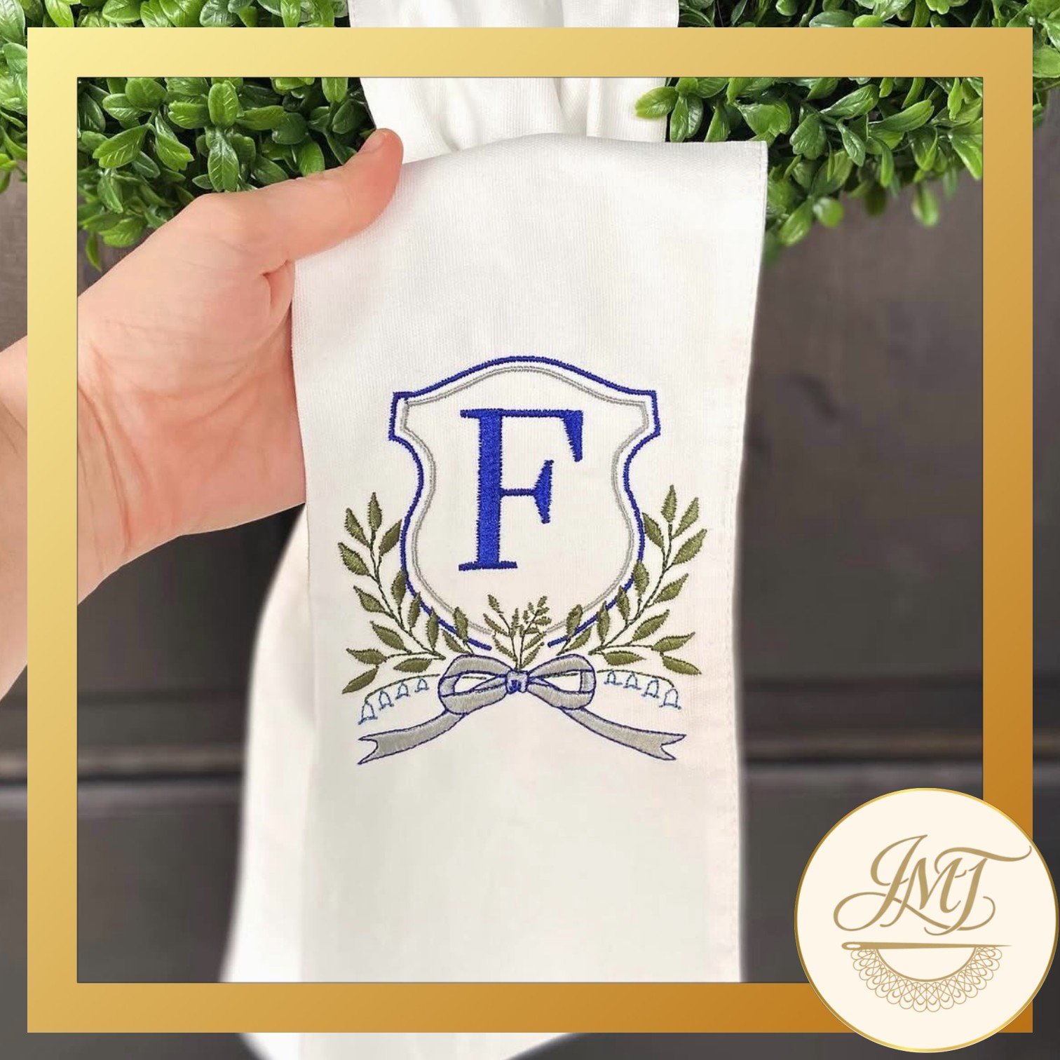 Crest Premium Initial on a white sash.