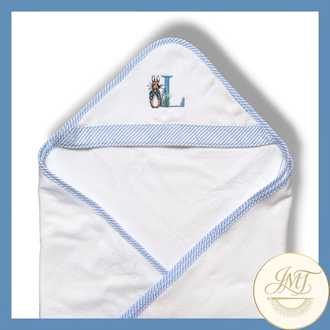 Peter Rabbitt-themed hooded towel for cozy bath times.