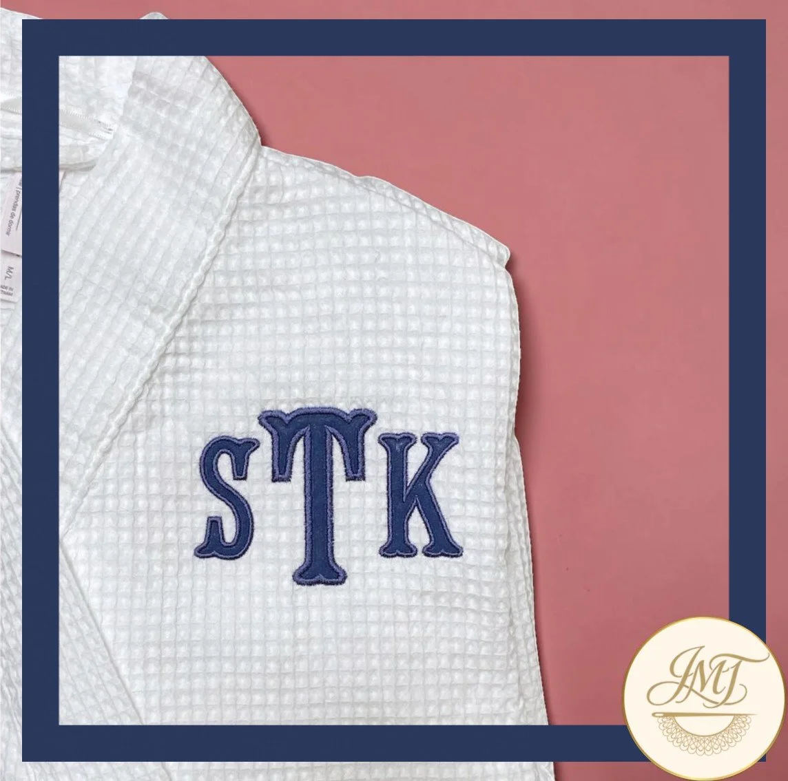 Robe with an applique monogram.