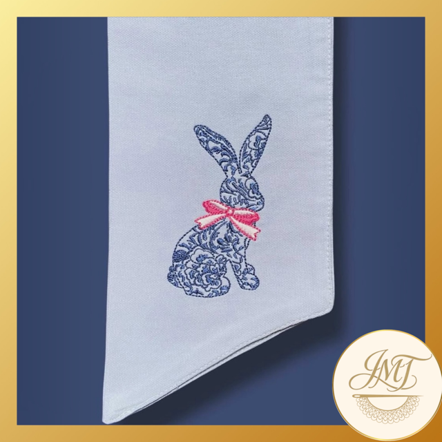 Chinoiserie Bunny design on a light blue sash.