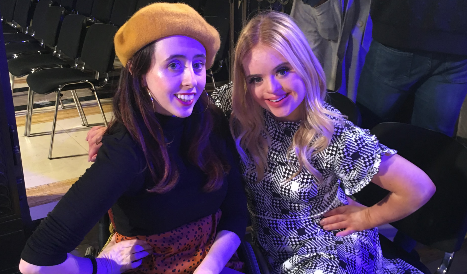 Two women smiling and posing for a photo.