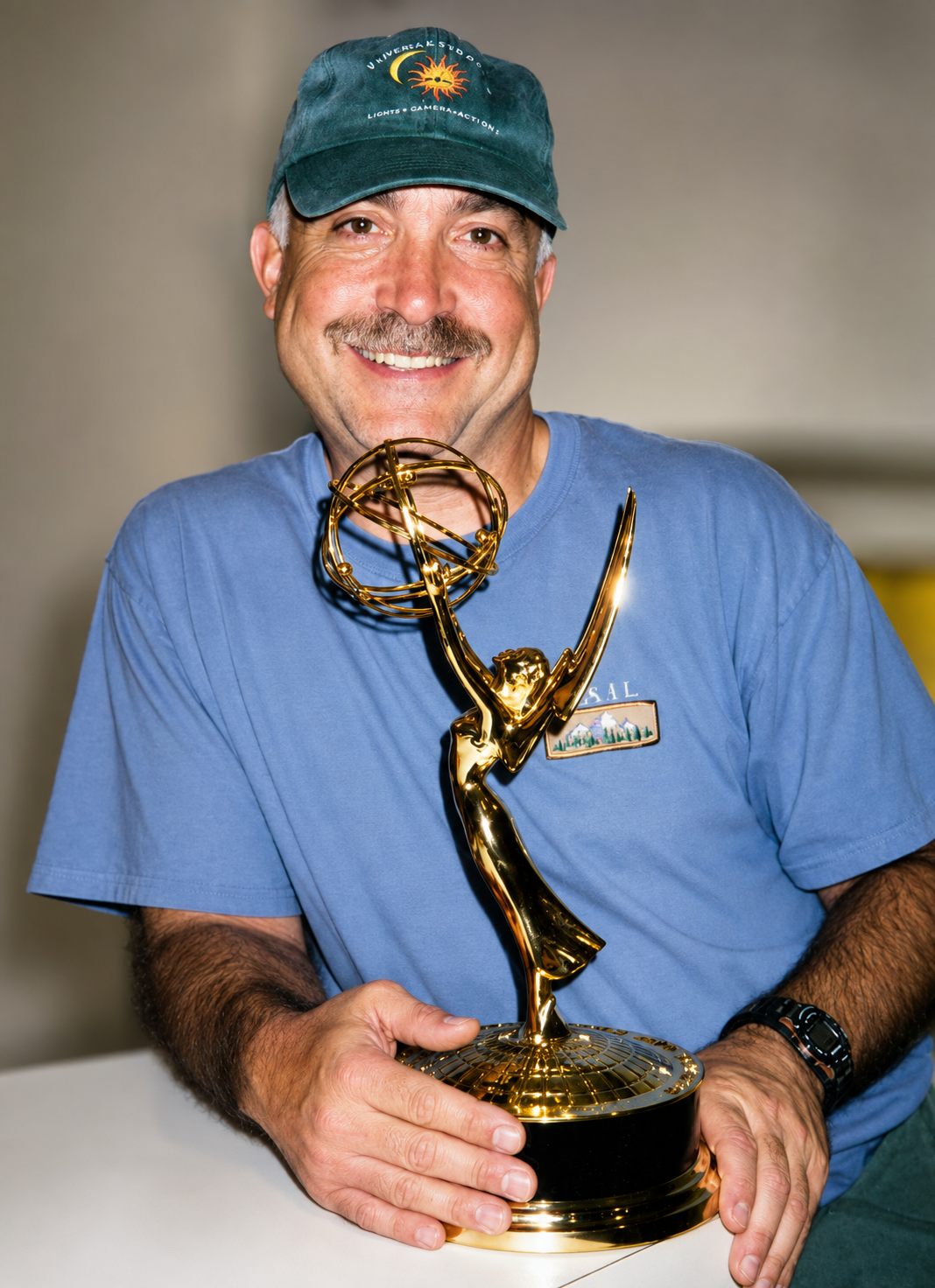 Jim Masi with his golden Emmy trophy.