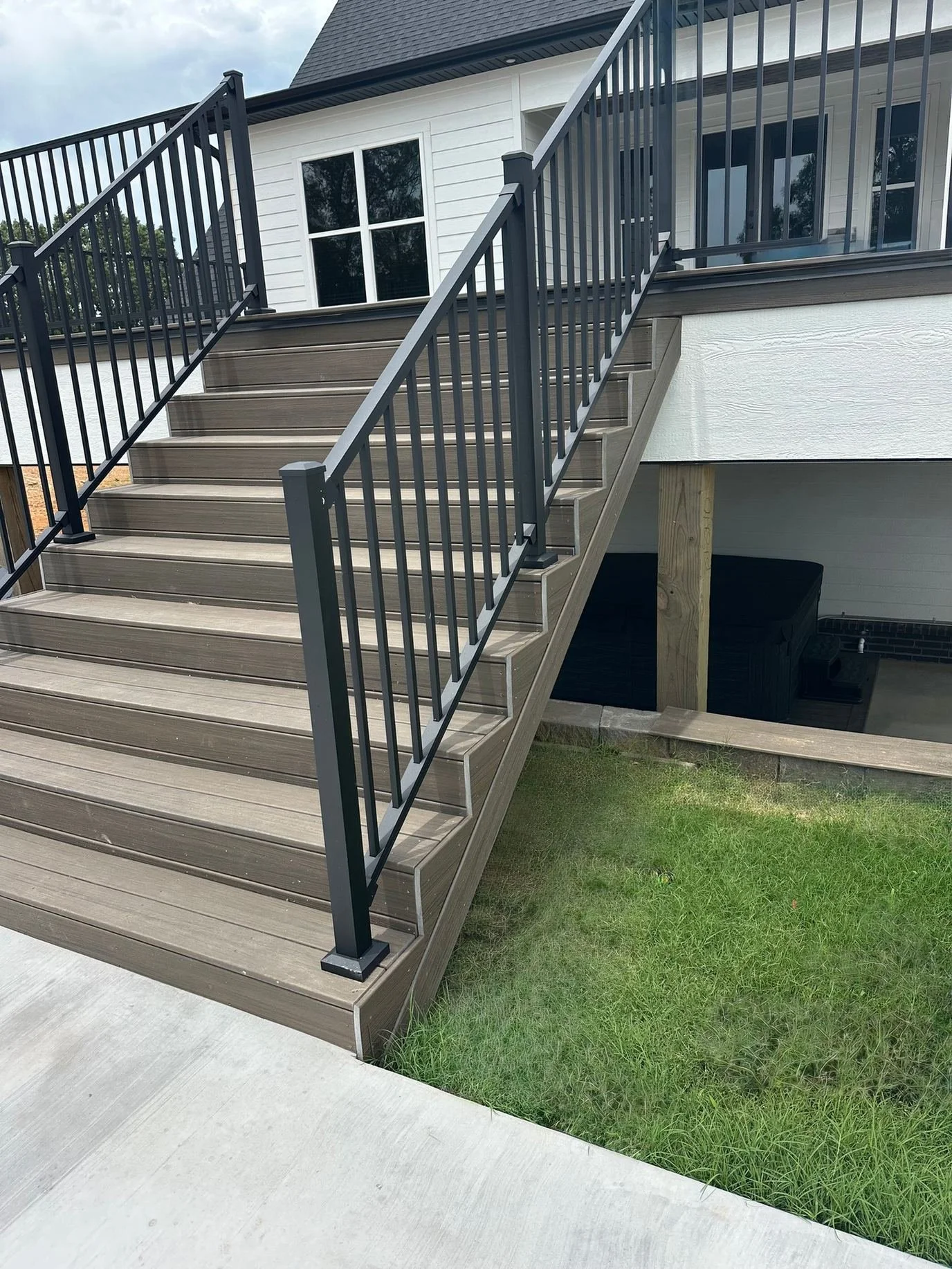 rj-construction-13-brown-stairs-dark-railing.jpg