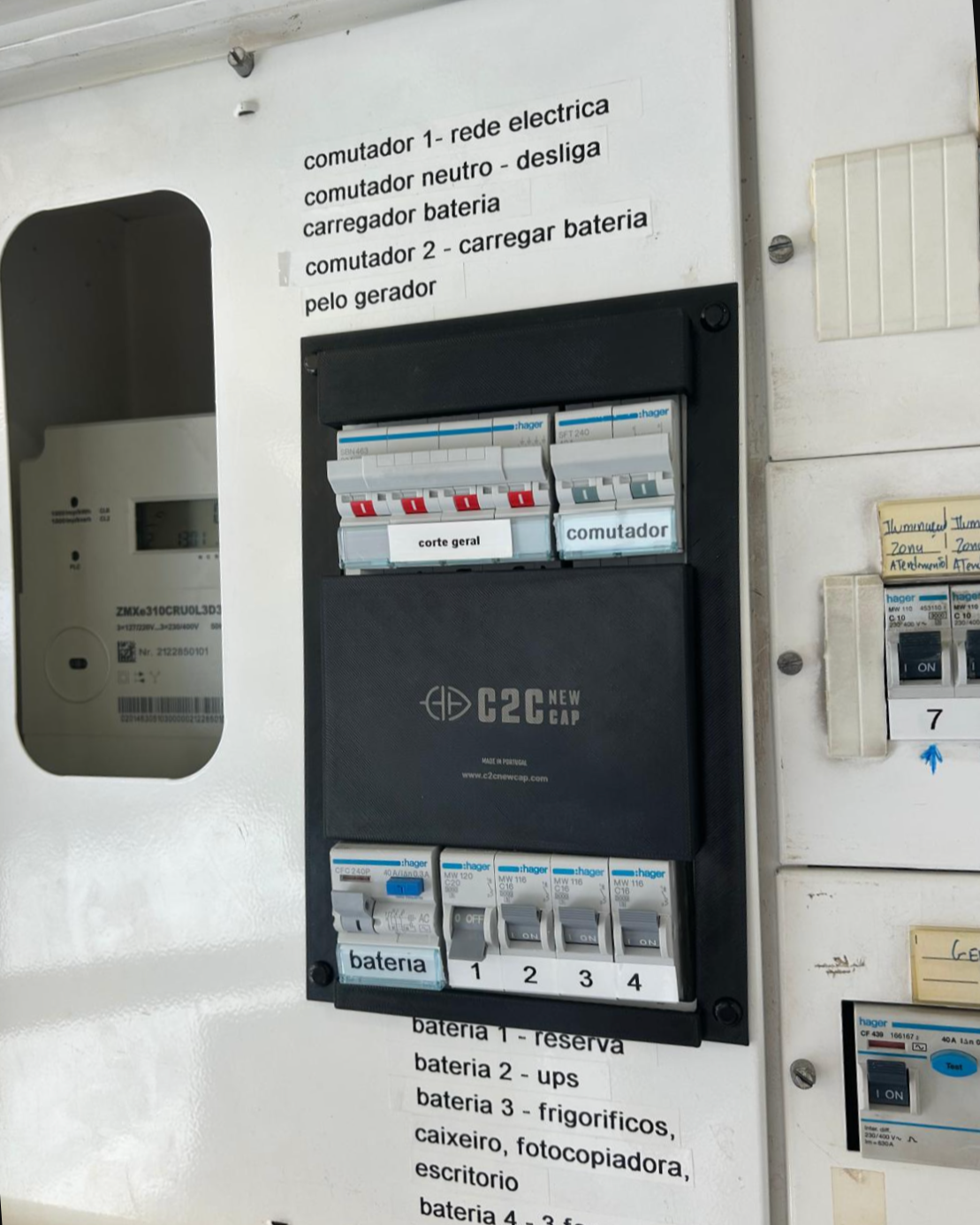 Electrical panel with switches and circuit breakers labeled for different electrical components, including battery backups and general power control.