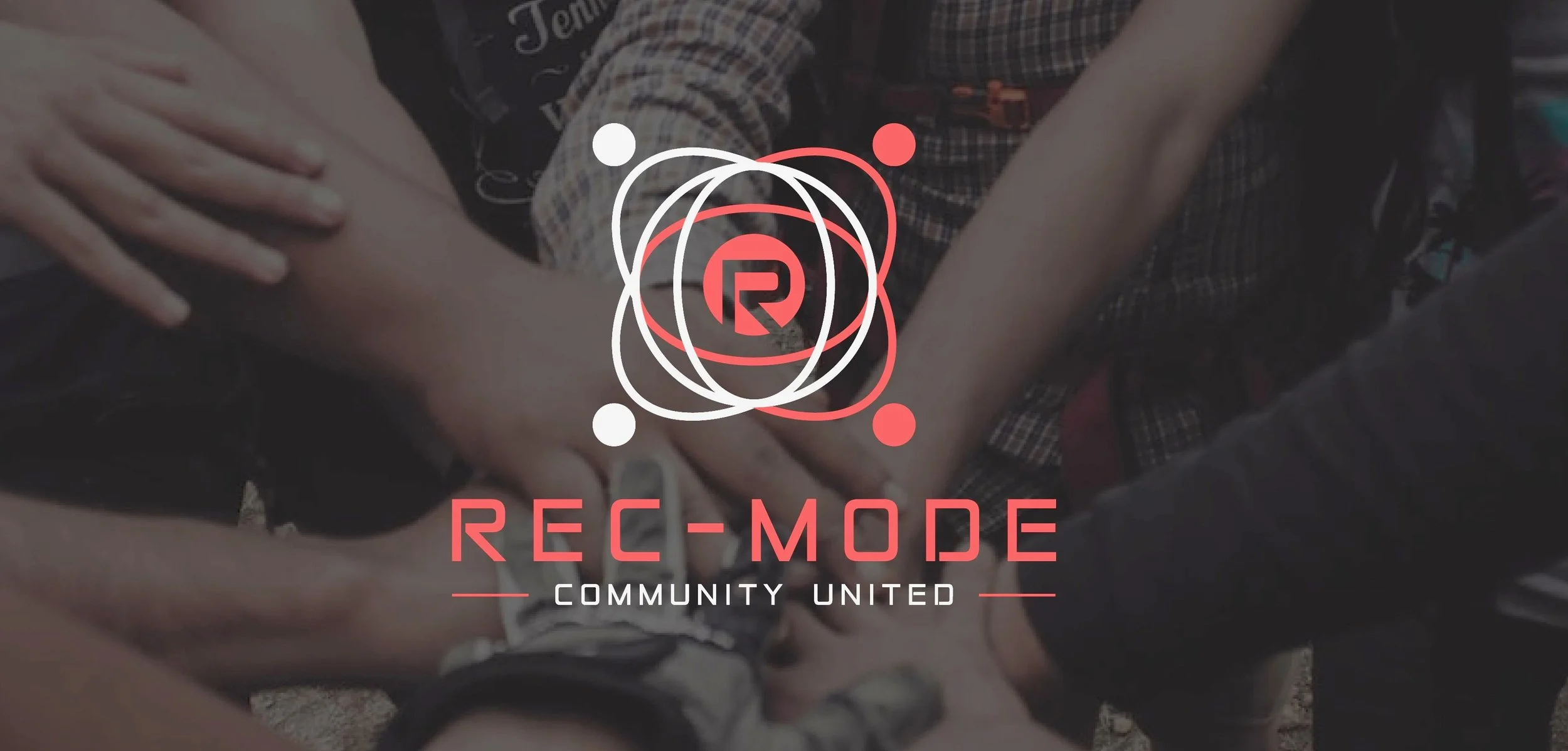 A group of people standing in a circle, putting their hands together in the center, with a graphic overlay of a logo and the words 'REC-MODE,' 'Community United' on top of them.