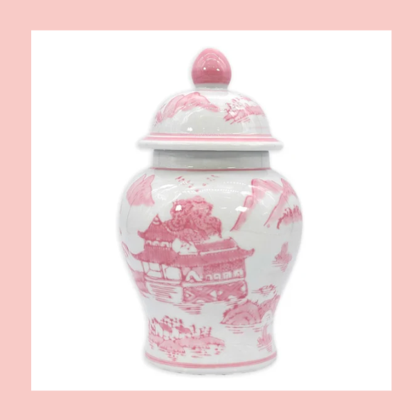 A white and pink porcelain jar with a lid, decorated with traditional Chinese landscape scenes.