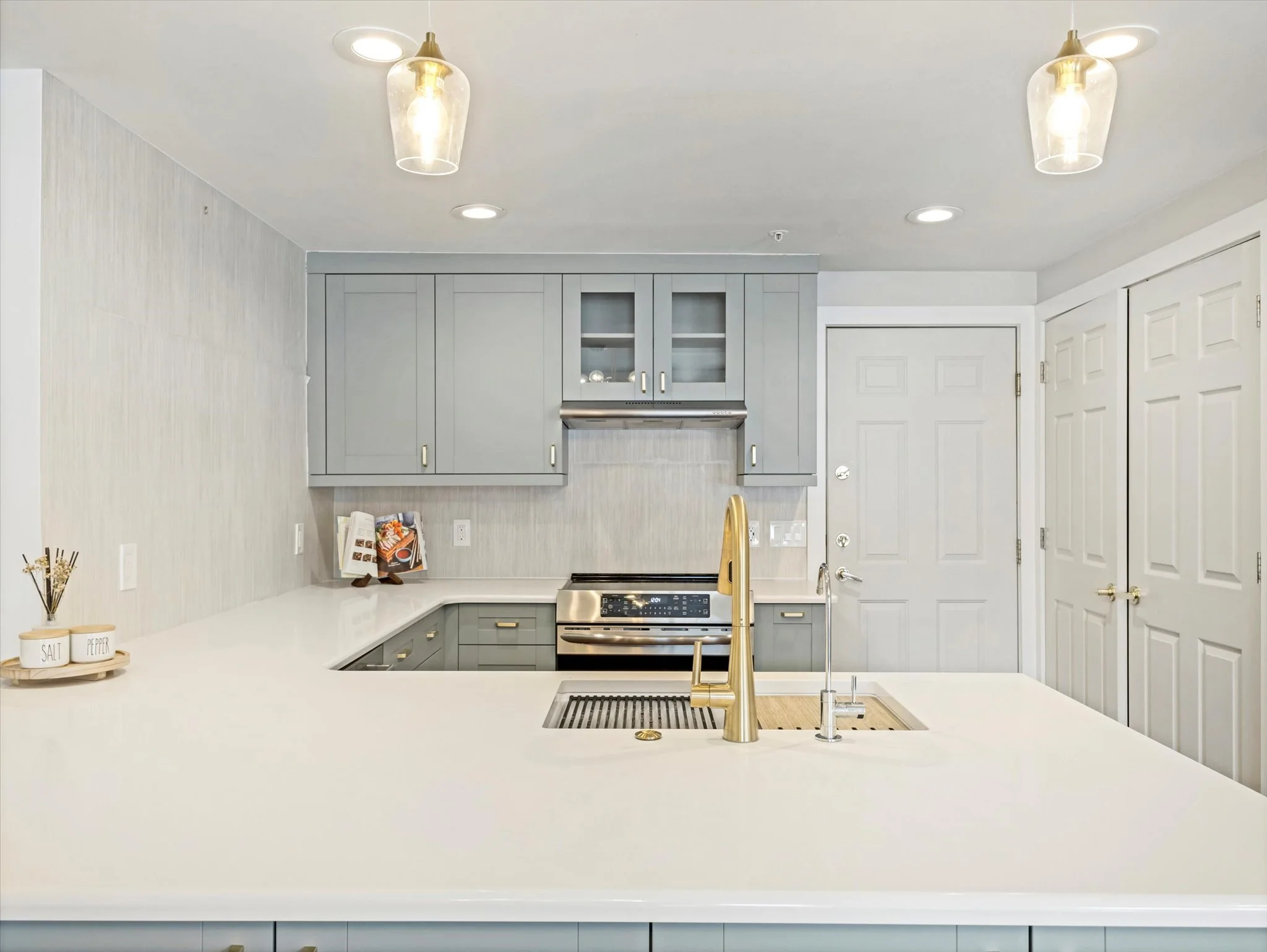 Upgraded, modern kitchen in Park City with two-toned cabinets and gold accents