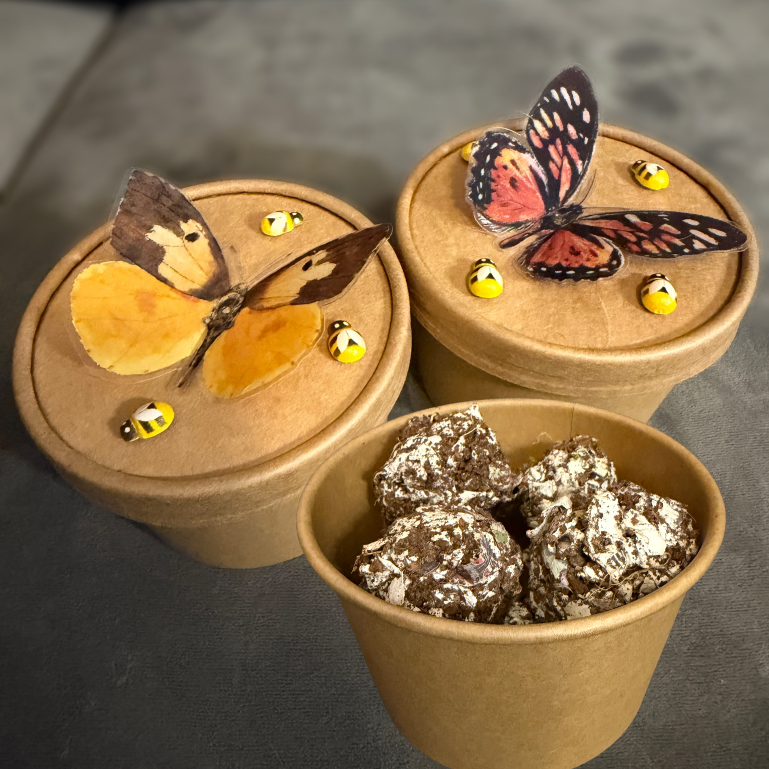 Seed balls in kraft cups with paper butterflies