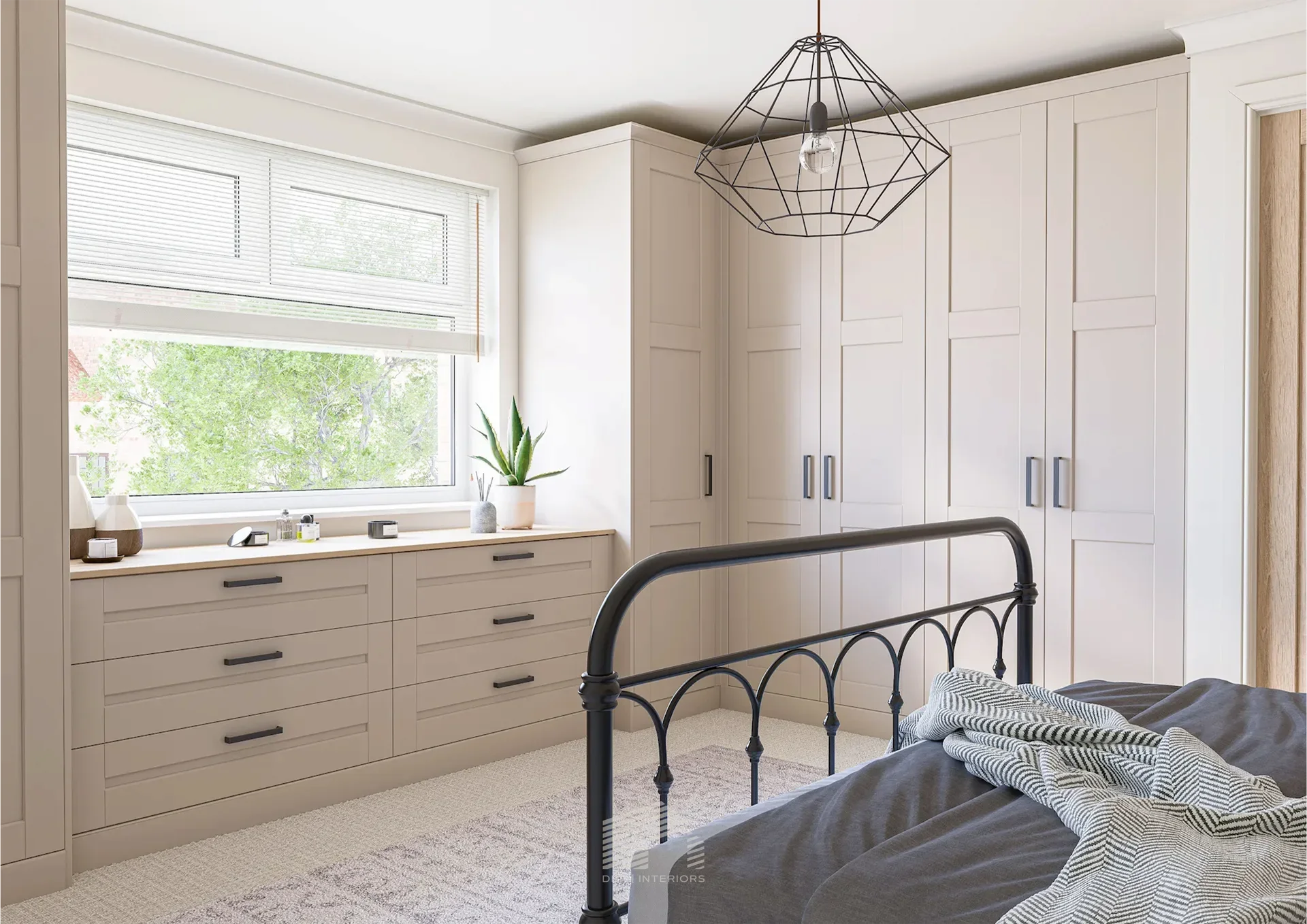 A minimalist bedroom with built-in white closets, a bed partially visible on the left, a dresser with decorative vases and dried plants in the center, and a large mirror on the right.