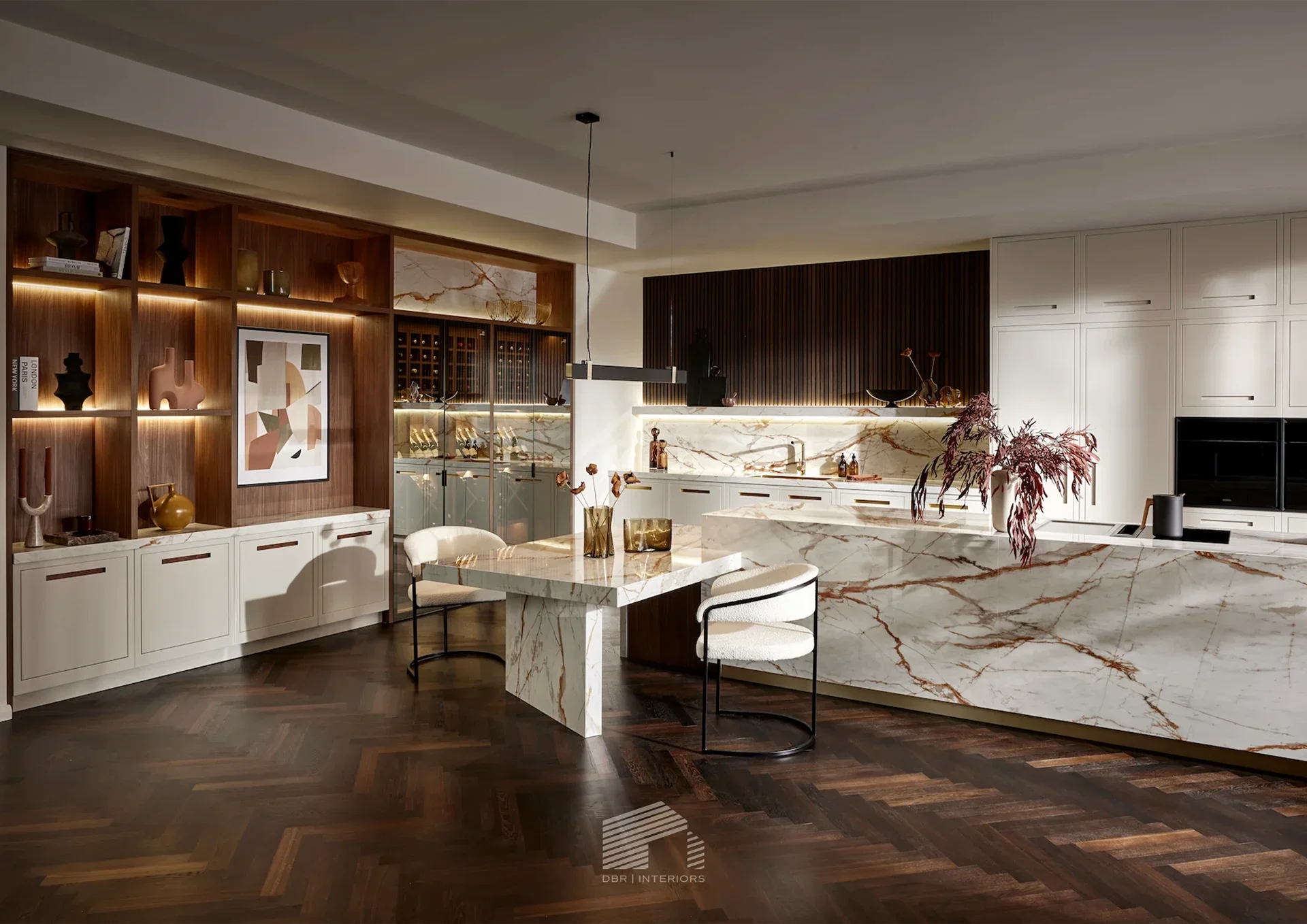 A white cabinet with a marble countertop and backsplash, decorated with amber glass vases and cups on the shelf, set in a modern kitchen or living space.