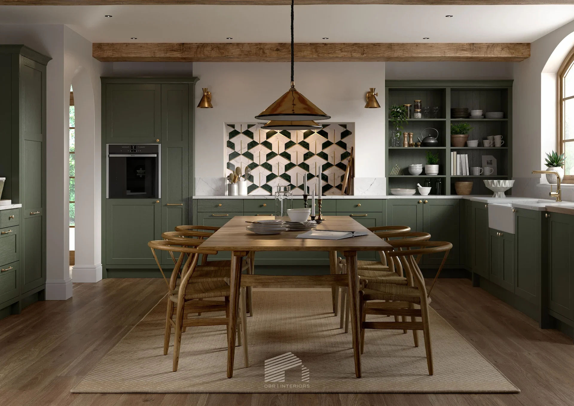 Modern kitchen with green cabinetry, open shelving, and a dining table with wooden chairs, decorated with bowls, glasses, and plants, under a copper pendant light.