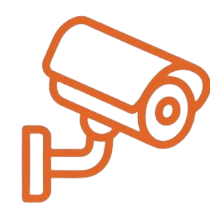 A security camera mounted on a wall, pointing downward.