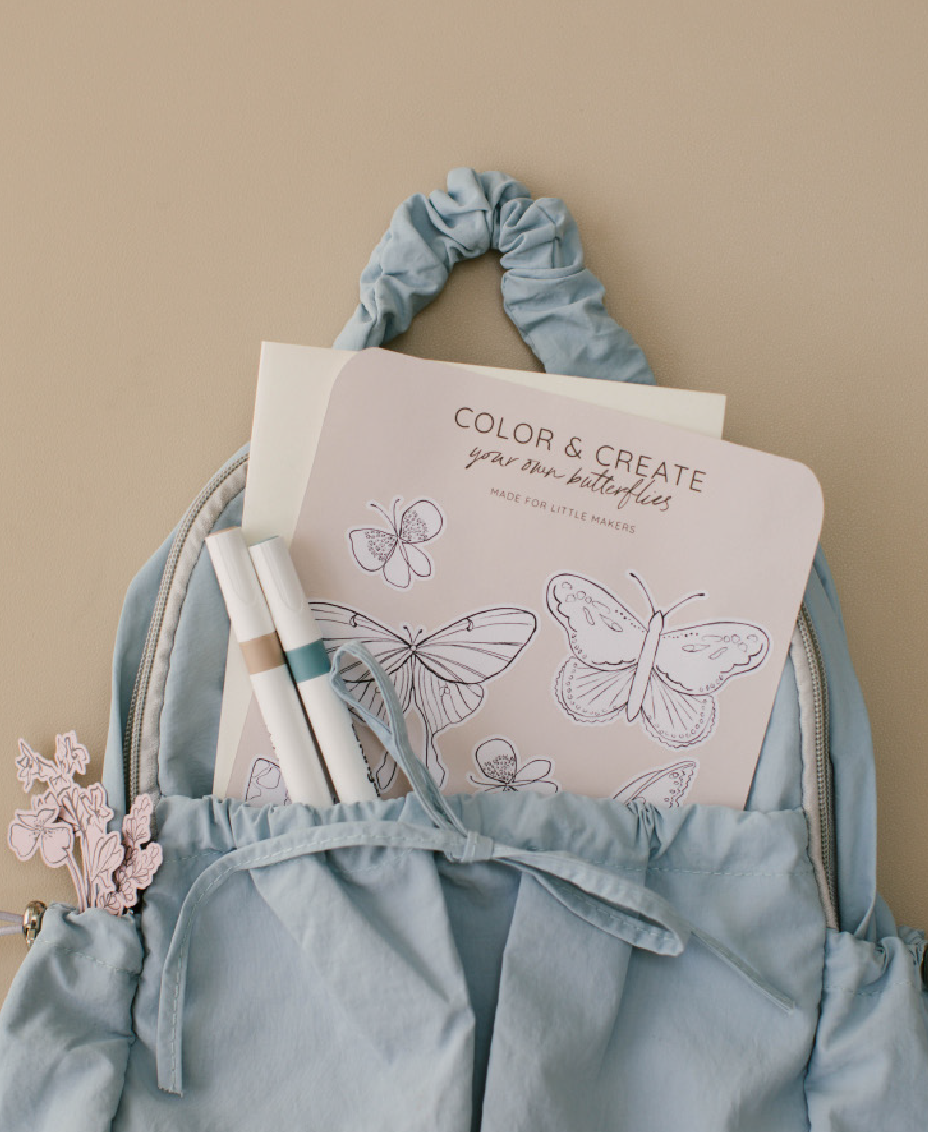 cadence-butterfly-sticker-sheet-blue-backpack.jpg