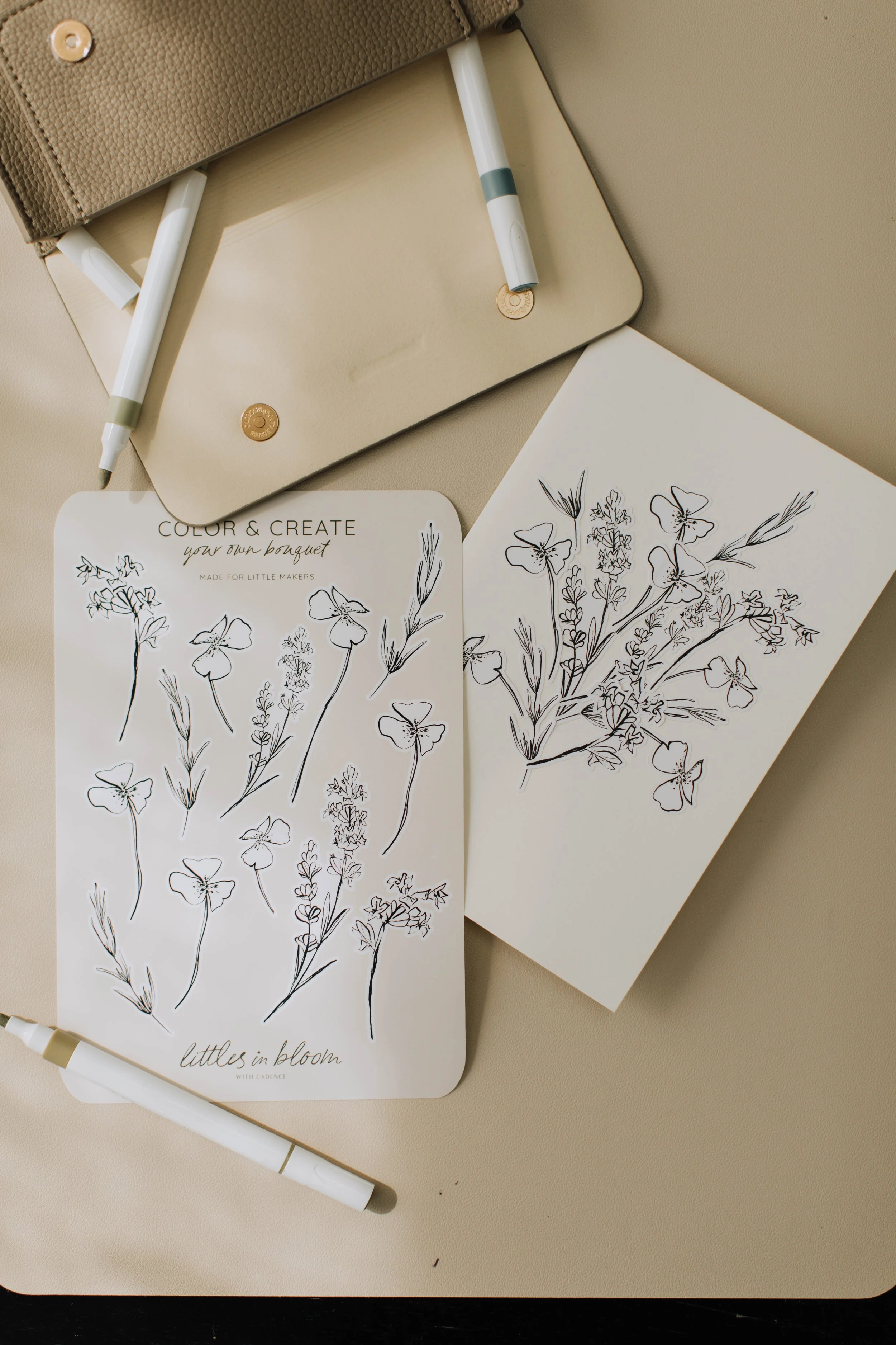 Flower Color + Create sticker sheet styled with markers on a neutral tabletop.