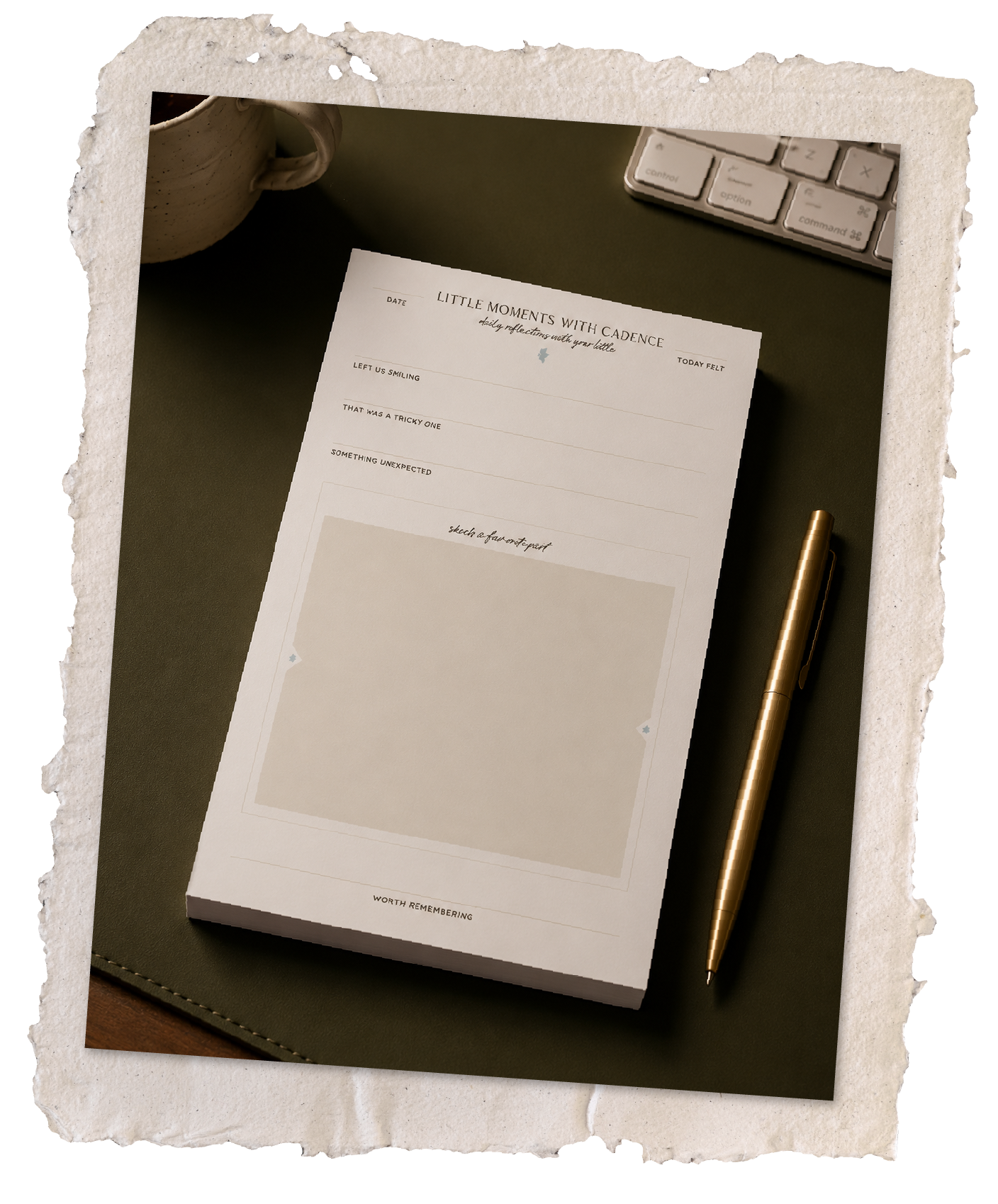 Little Moments with Cadence conversation pad on a desk beside a gold pen.