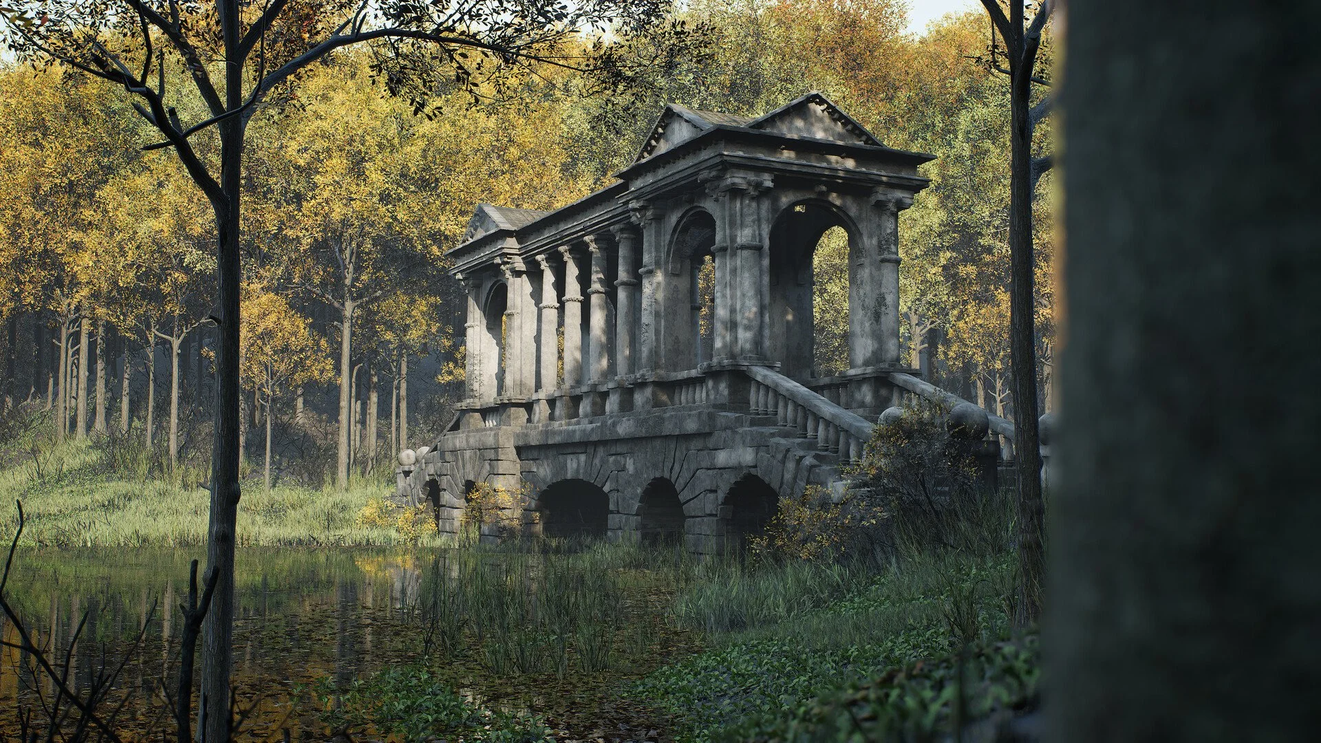 A stone bridge with arches and balustrades in a wooded area during autumn, with trees displaying yellow and orange leaves surrounding the bridge and reflected in the water below.