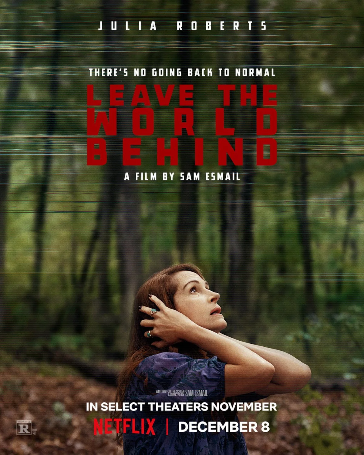 Poster for the film "Leave the World Behind" featuring Julia Roberts, with a woman looking up in a forest setting, and text indicating the release date on Netflix.