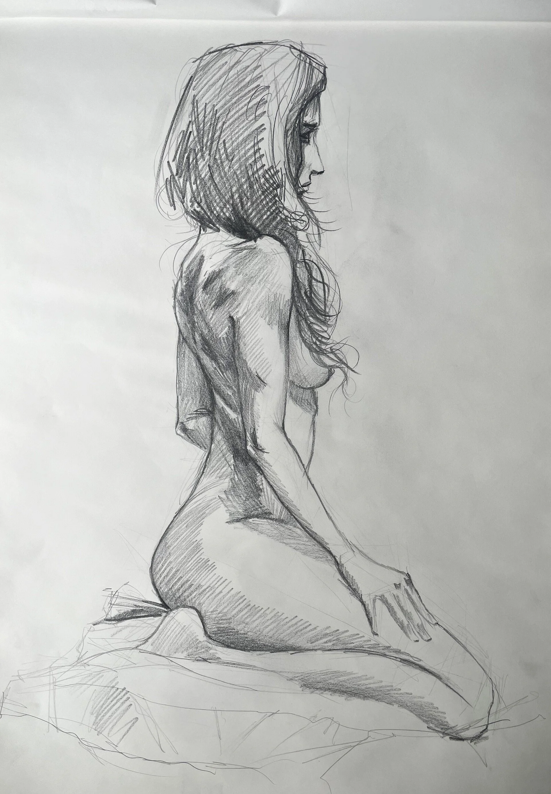 A pencil sketch of a seated woman in profile with long, wavy hair and bare shoulders.
