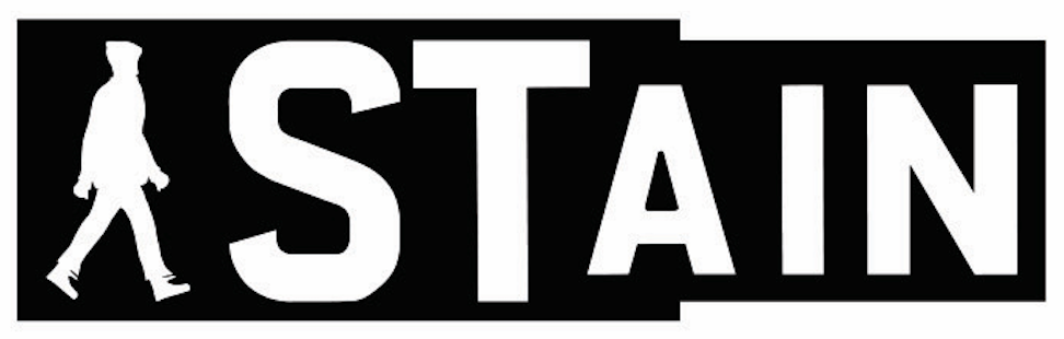 Sign with the word 'STAIN' and a silhouette of a walking person on the left side.