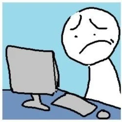 A cartoon character with a concerned facial expression sitting at a desk in front of a computer.
