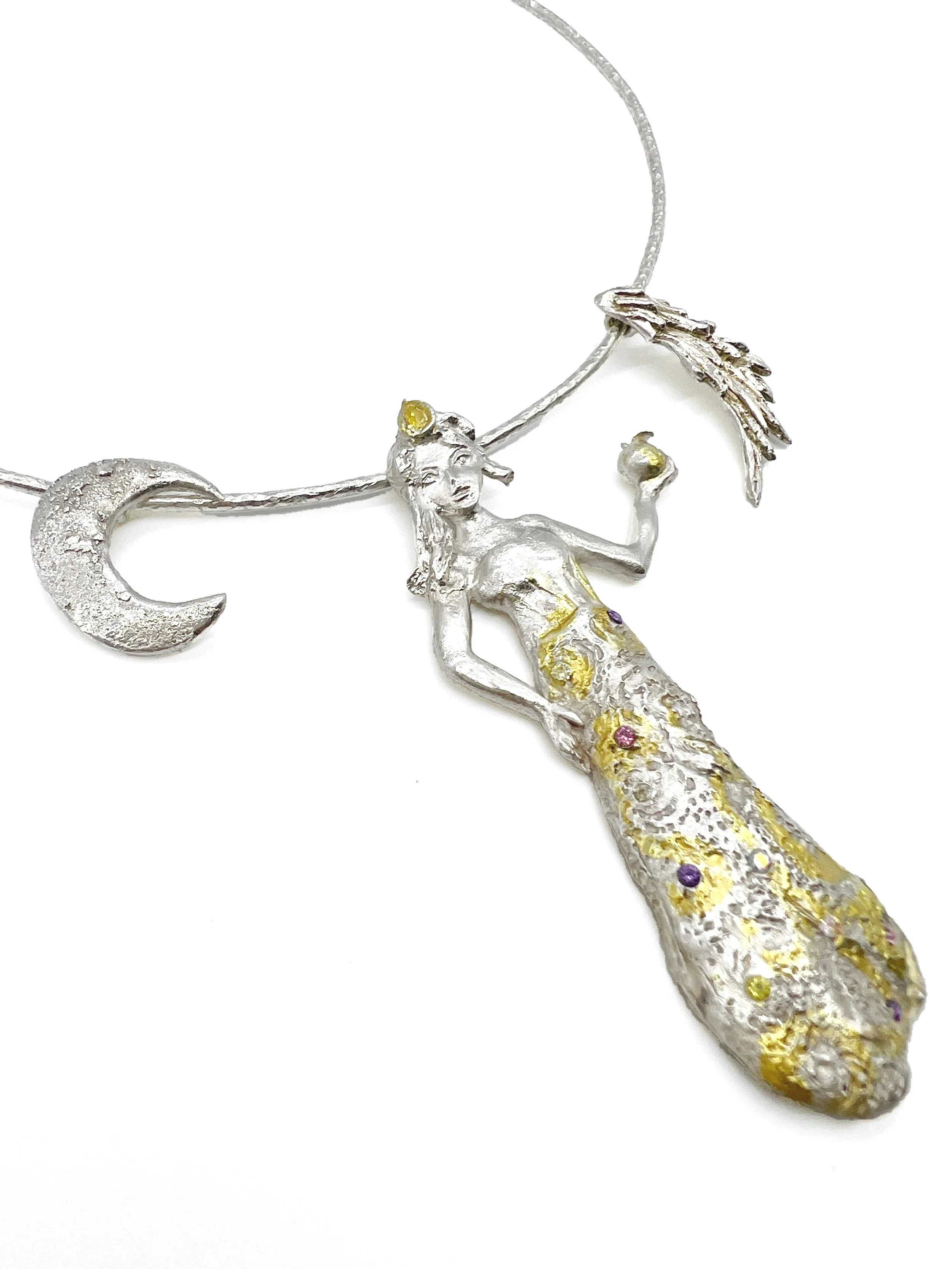 Silver necklace with a fairy pendant featuring a detailed mermaid tail, sparkling yellow, pink, and purple gemstones, and elements resembling a moon and a wing.