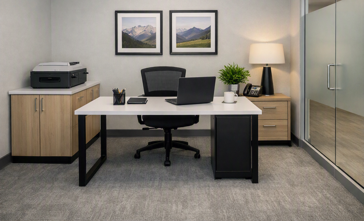 A compact and functional workspace with a clean desk, soft lighting, and minimal décor. Perfect to showcase efficiency, order, and attention to detail in small corporate environments.