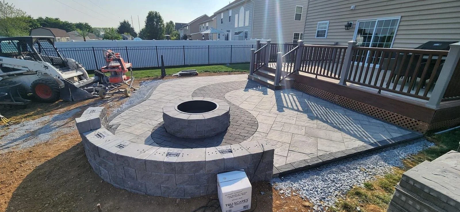 Custom paver fire pit installation and block retaining wall in Saratoga Springs, Utah — Aspen Stone Design