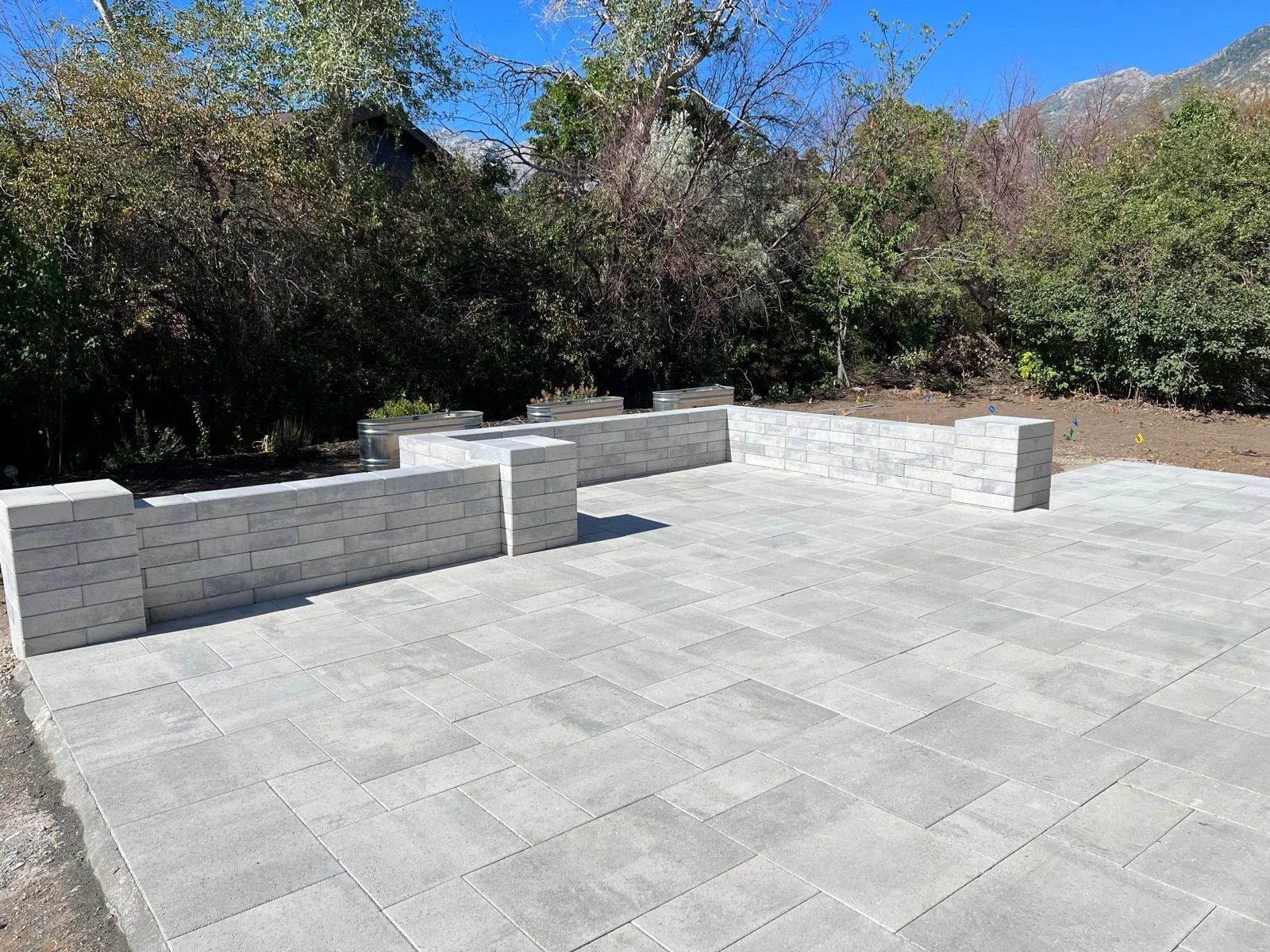 Custom multi-level paver patio and retaining wall block system in Spanish Fork, Utah — Aspen Stone Design
