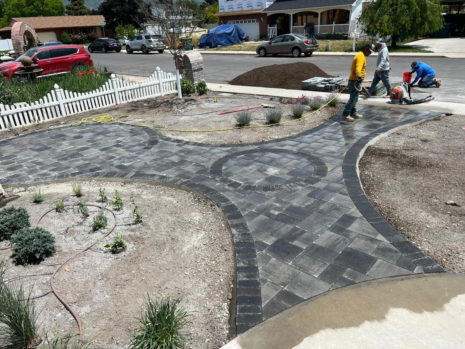 Superior stone craftsmanship and custom paver driveway border in Lehi, UT — Aspen Stone Design