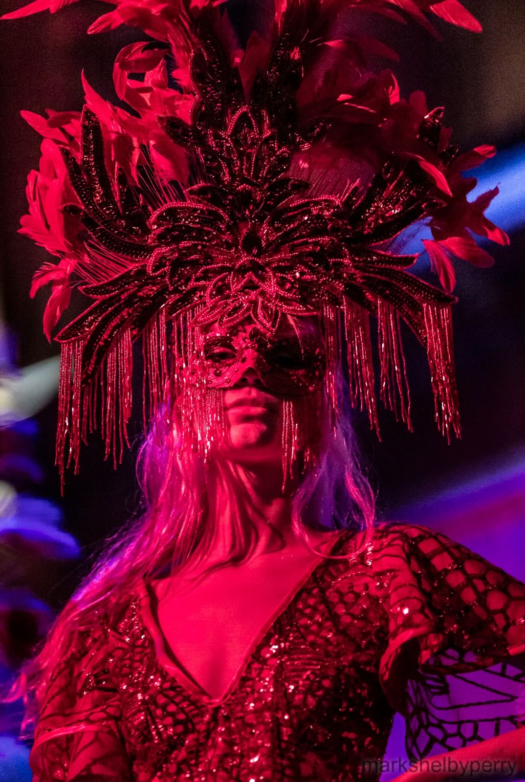 Red feathered headdress and mask. Past Astarte Creative performance.