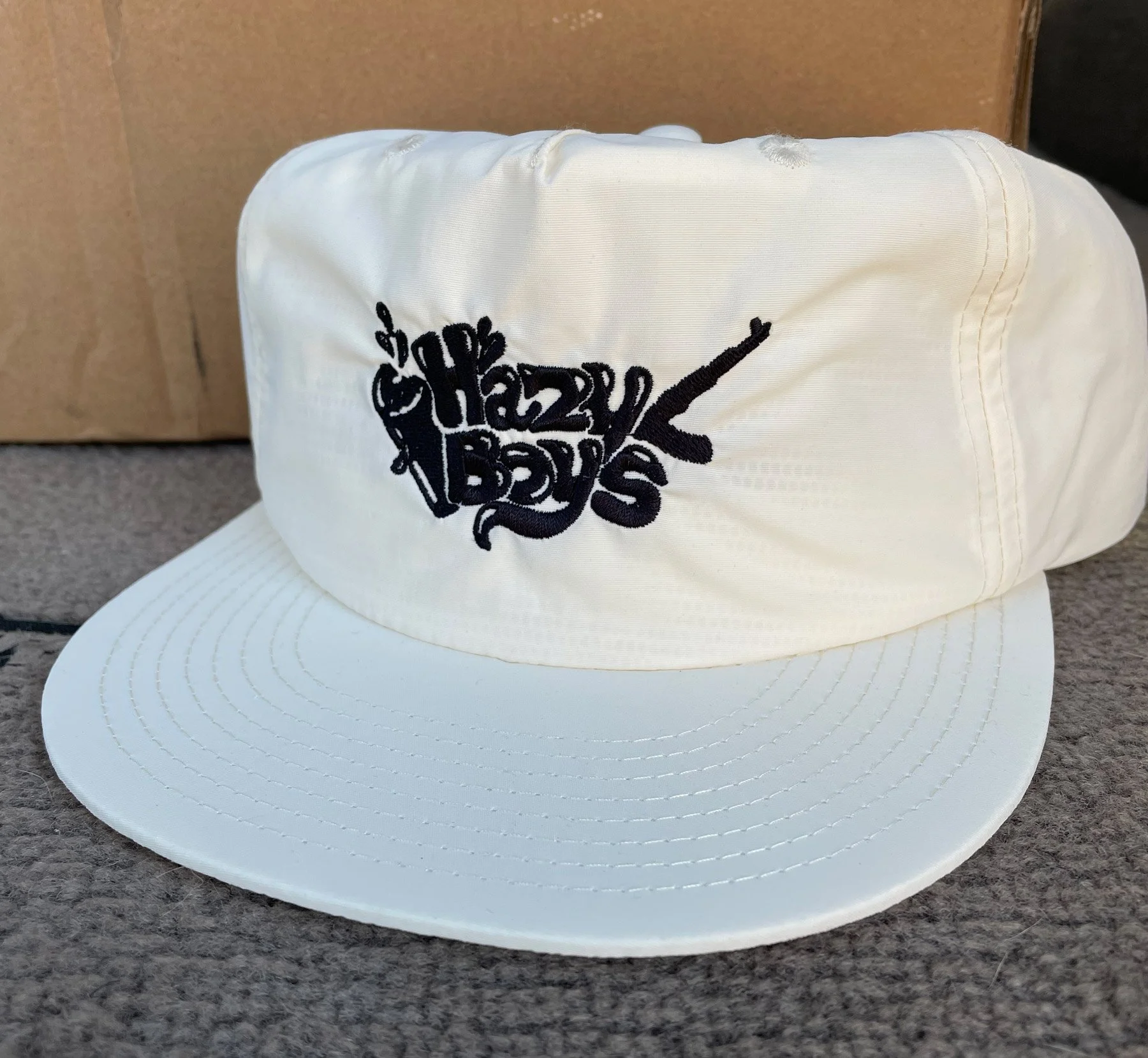 White baseball cap with black embroidered logo reading 'Shady Boyz' and a stylized microphone graphic.