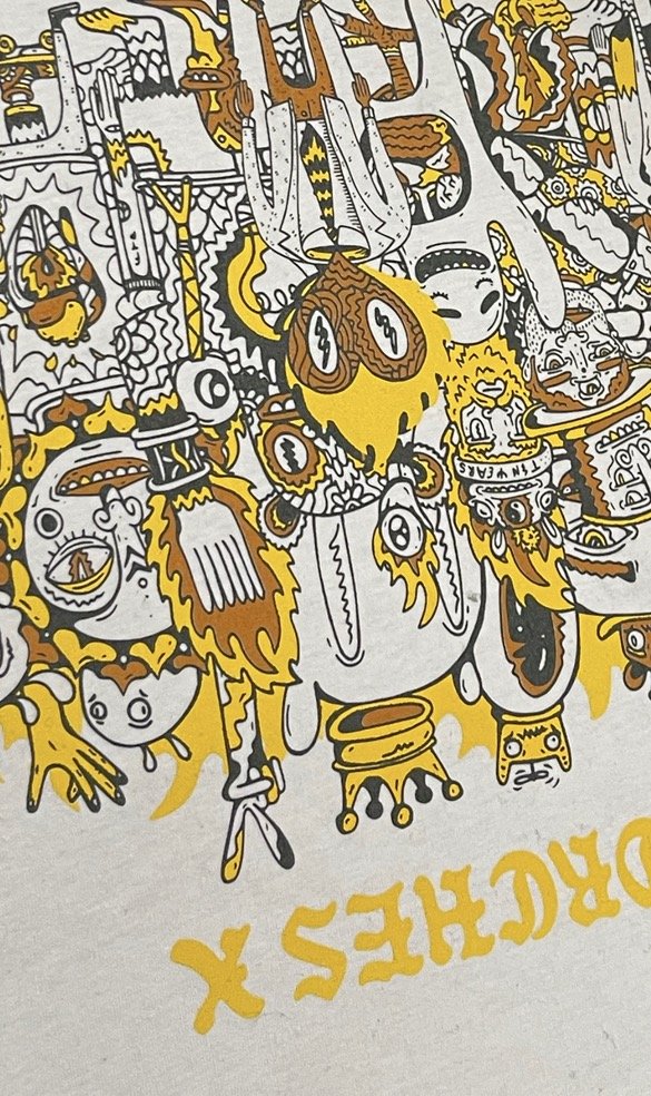 Colorful, cartoon-style illustration featuring various exaggerated characters, animals, and objects in yellow, brown, black, and white, scattered in a busy, playful scene.