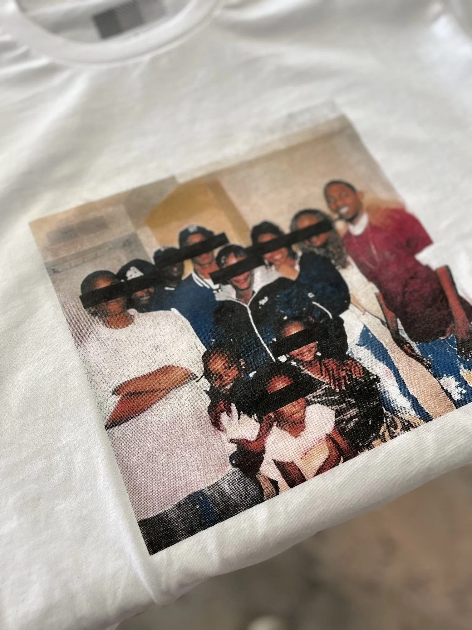 A group of children and two adults posing for a photo indoors.