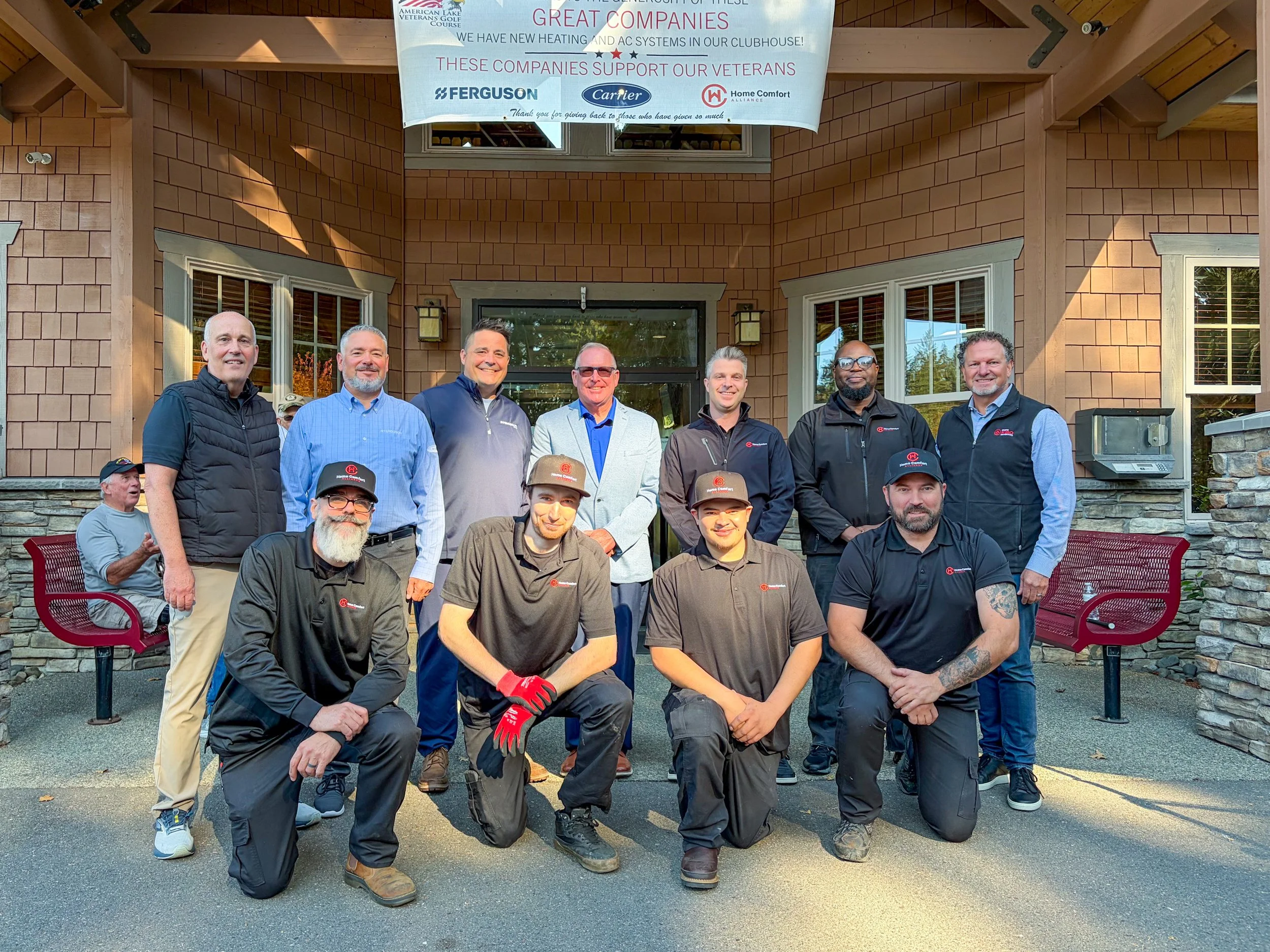 The American Lake Veterans Golf Course team and HVAC donation partners gather in front of the clubhouse entrance.