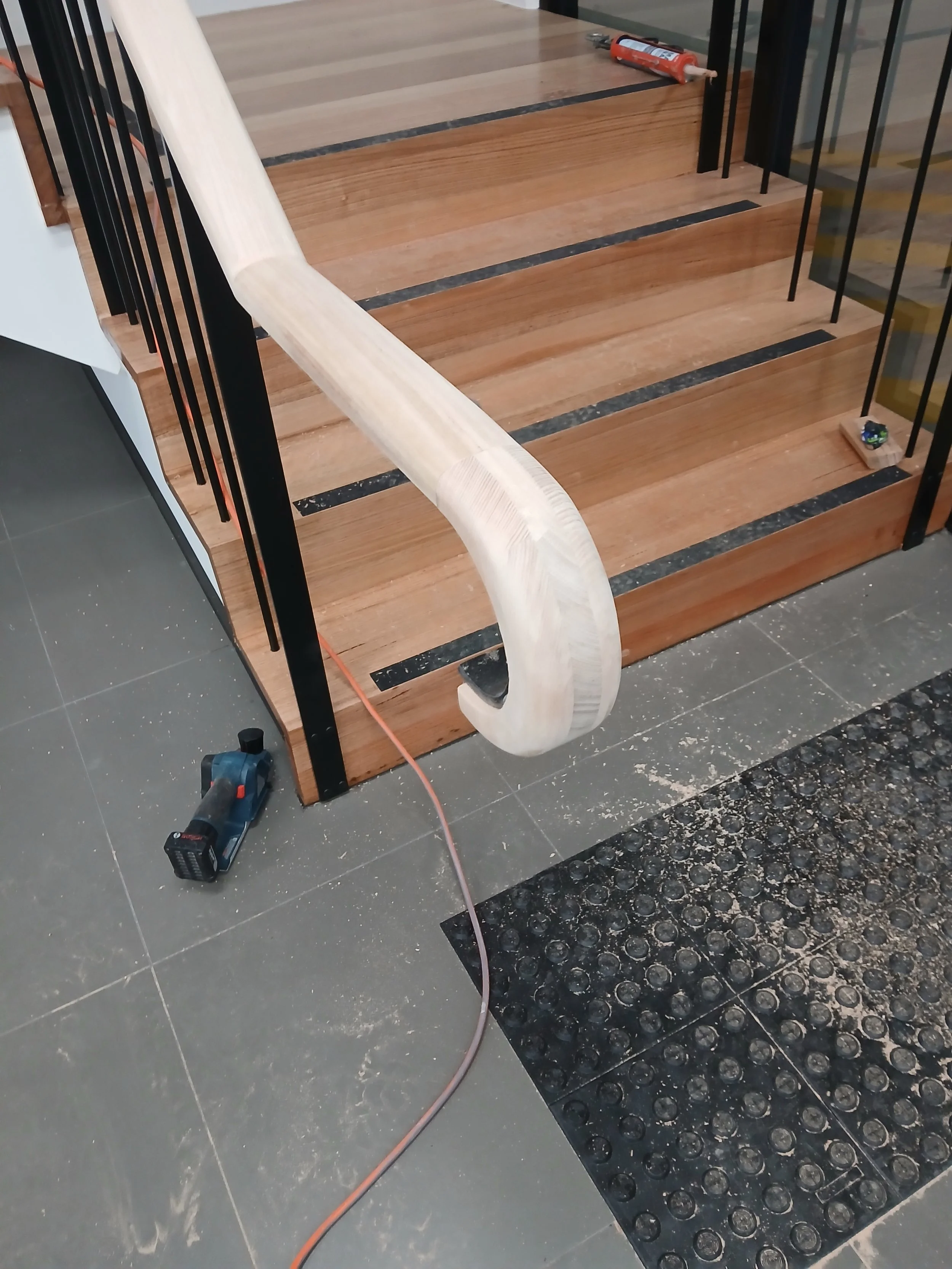 commercial stair with timber on hockey stick end.jpg