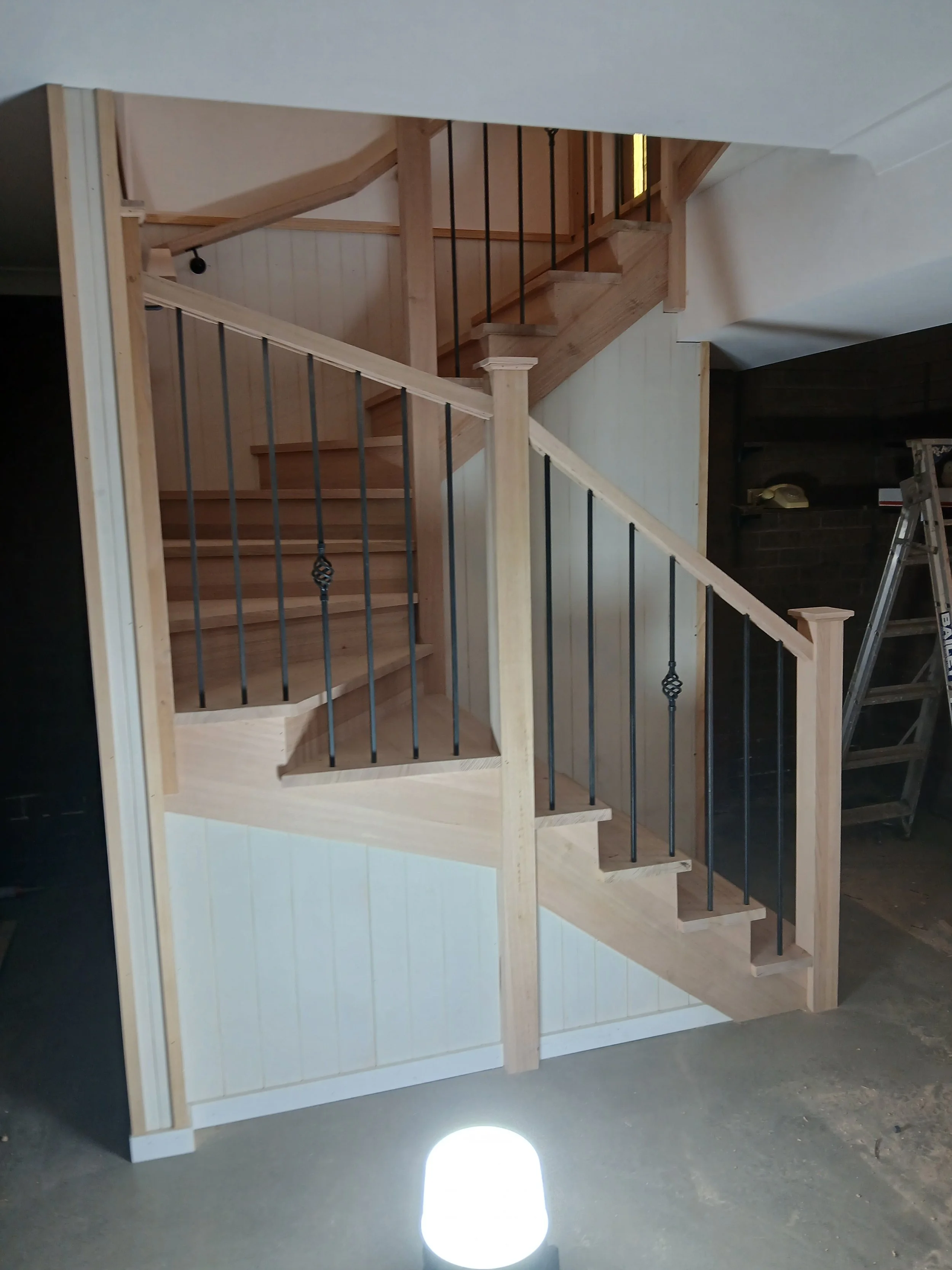 hardwood stair with caps and hardwood handrail.jpg